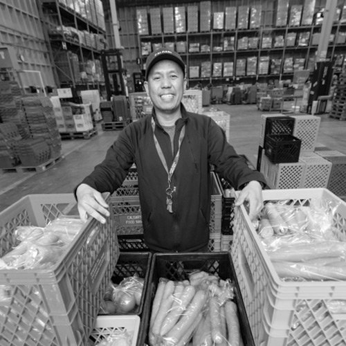 PIcture of a volunteer at the Calgary Food Bank